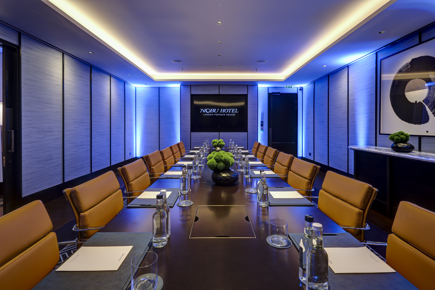 Sayuri Room boardroom with leather seating for executive strategy sessions and business meetings.