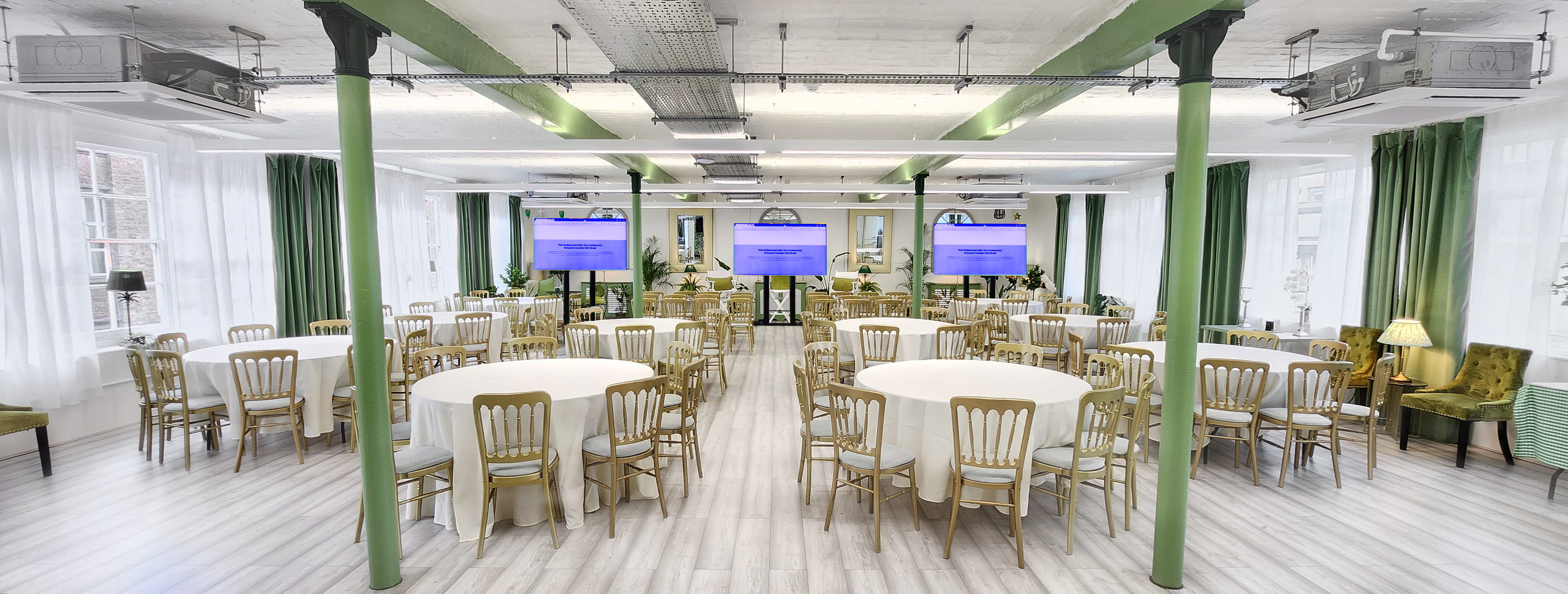 Elegant event space with round tables, ideal for meetings and social gatherings. - Banner