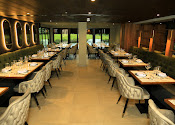 Stylish Tanishq Restaurant with elegant tables, perfect for corporate events and celebrations. - Banner