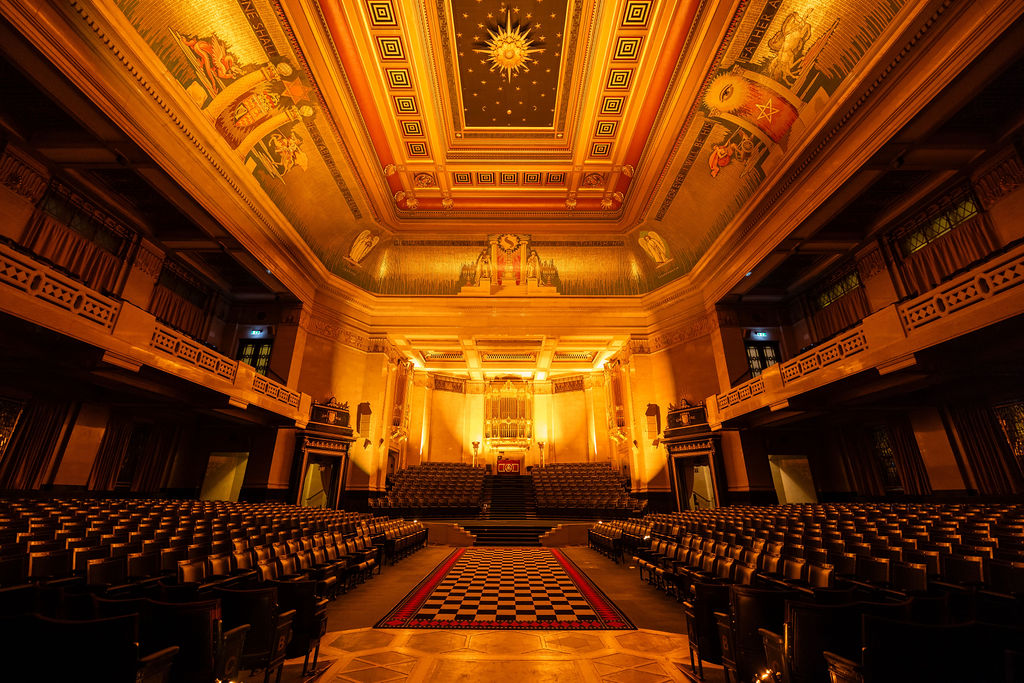 Historic auditorium at The Grand Temple with ornate doors for keynote events and gala ceremonies.