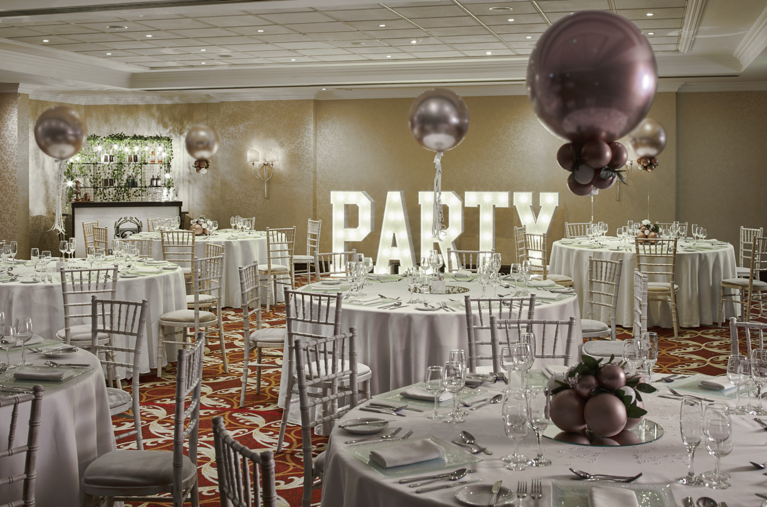 Elegant Worsley Suite event space with round tables, perfect for weddings and parties. - Banner