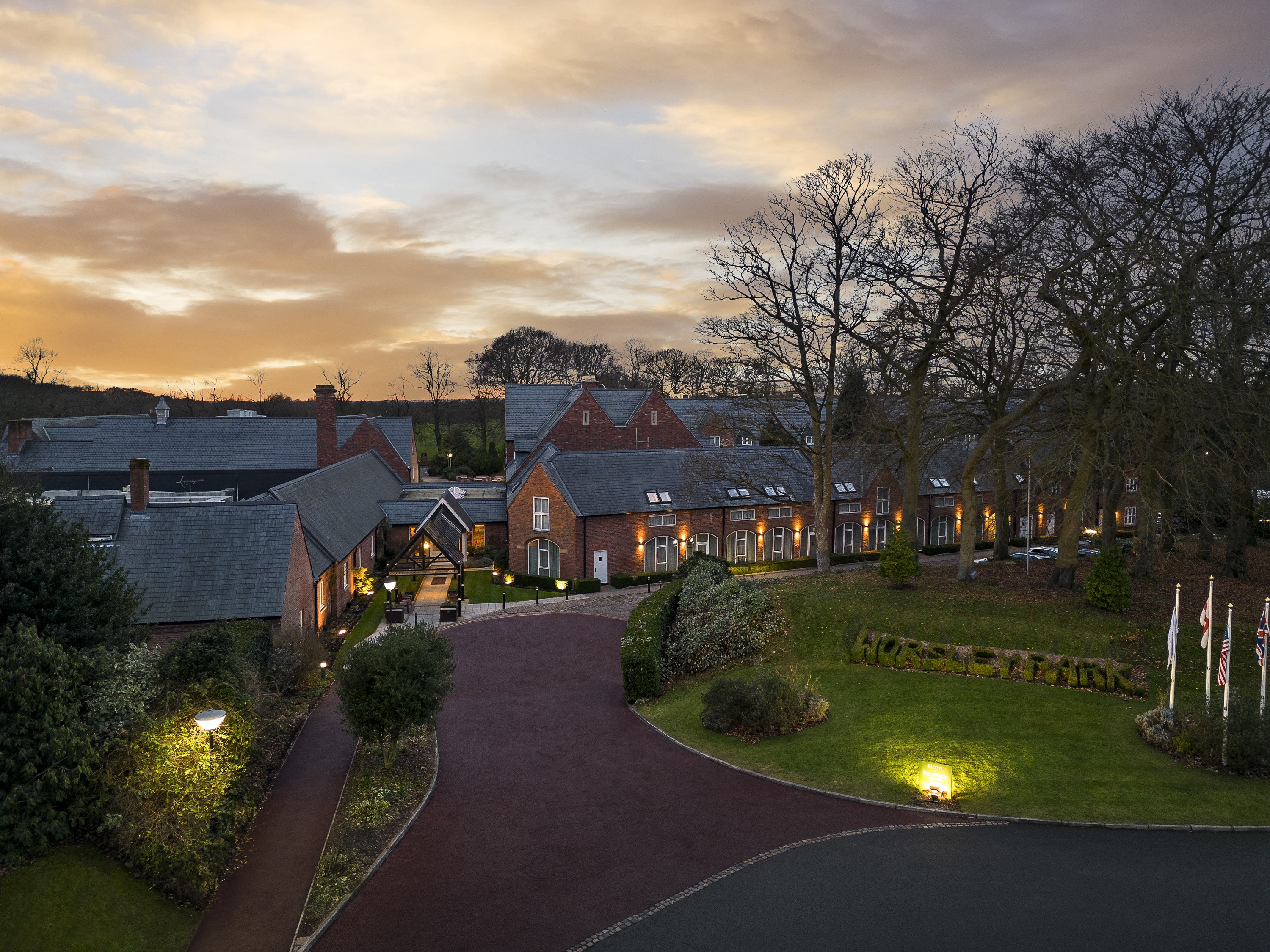 Worsley Suite at Delta Hotels, elegant venue for corporate events with sunset backdrop. - Banner