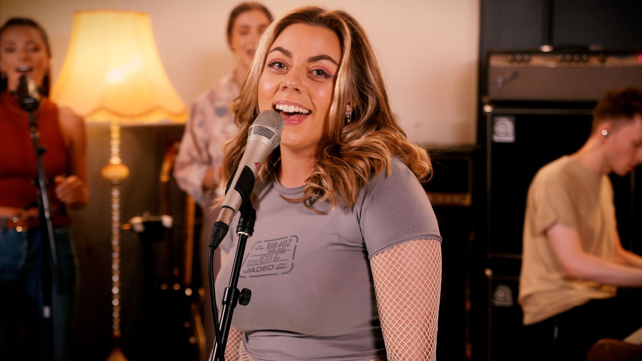 Lively performance at The Crypt Studio with warm lighting for engaging events. - Banner