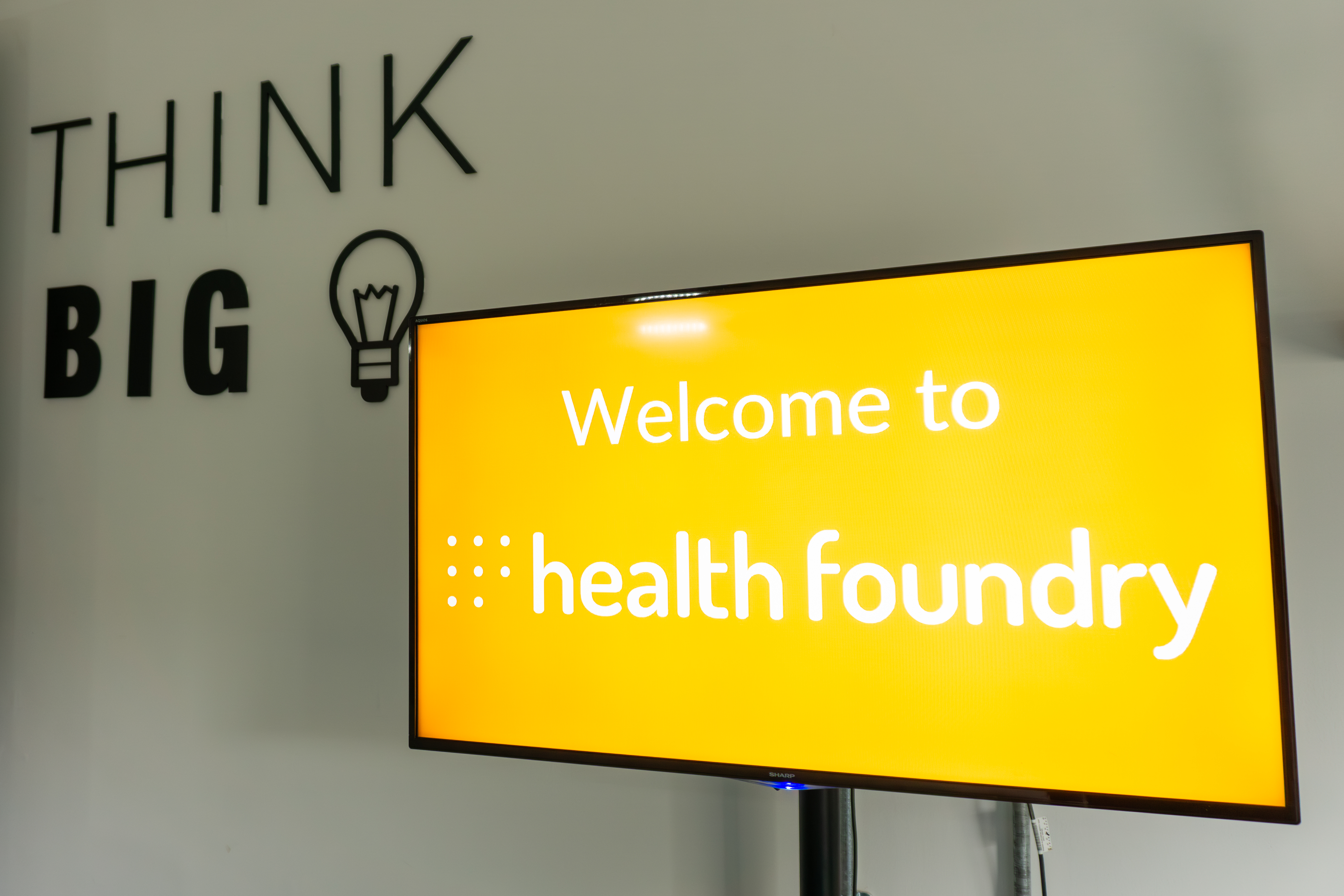 Medium Meeting Room at Health Foundry with "THINK BIG" display for innovative events.
