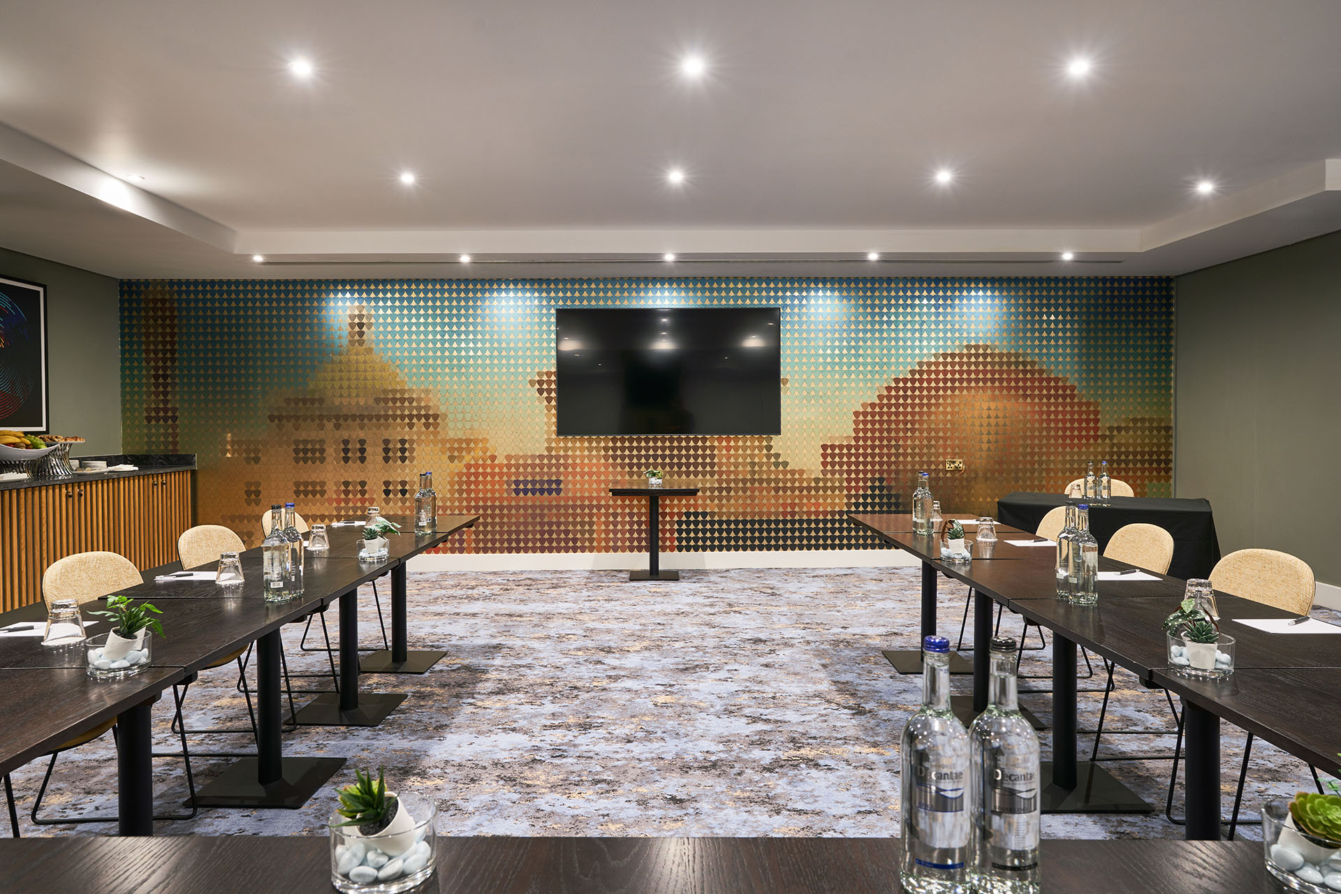 Modern meeting room at The Cumberland Hotel with vibrant decor for professional events. - Banner