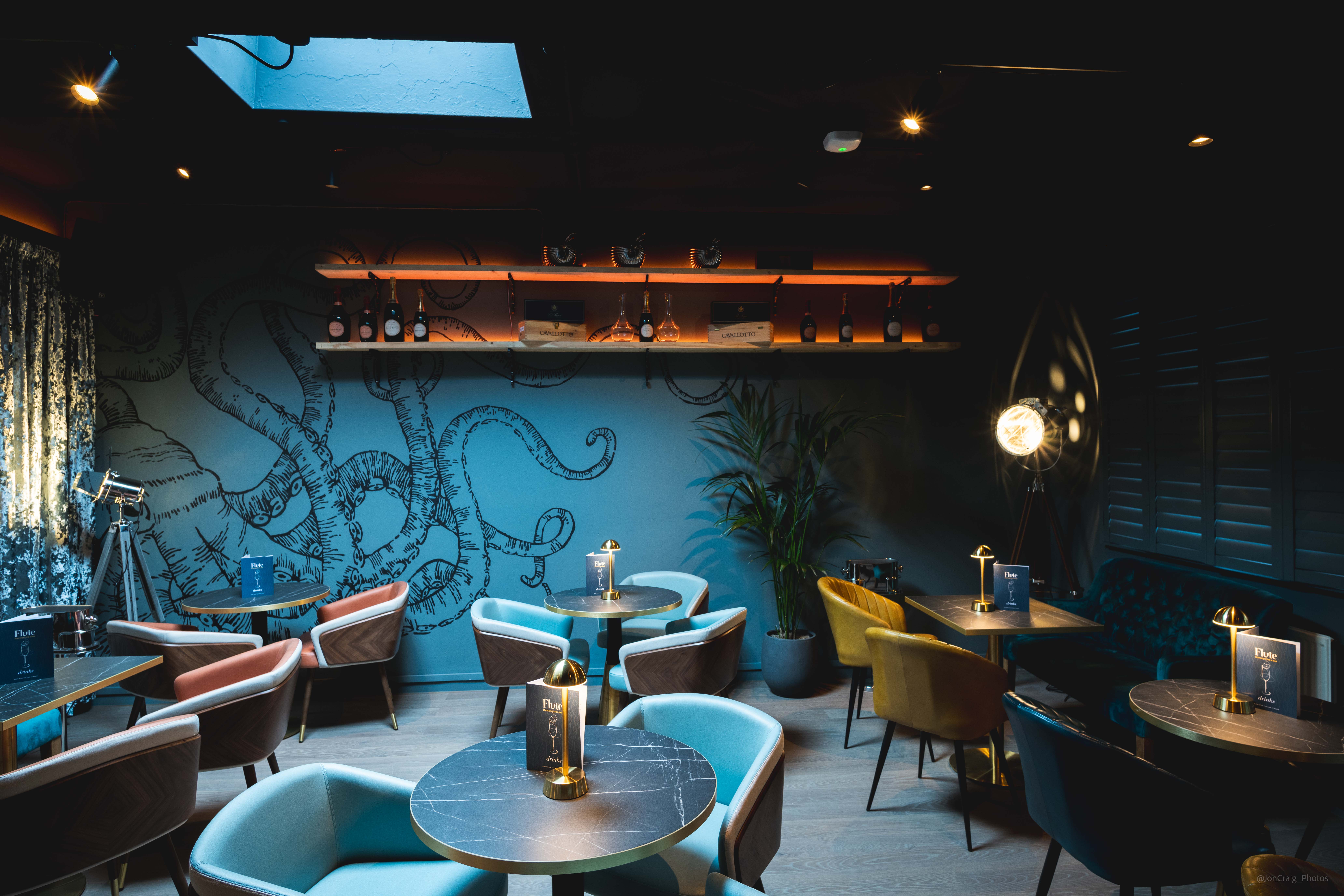 Stylish venue with octopus mural for intimate meetings and events.