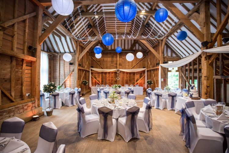 Meadow Barn event space with round tables, ideal for weddings and upscale gatherings. - Banner