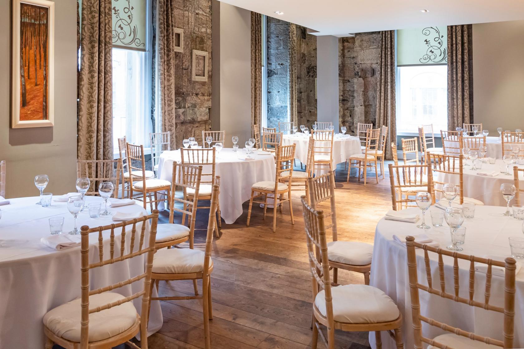 Elegant event space in Citation Glasgow with round tables for weddings and receptions.
