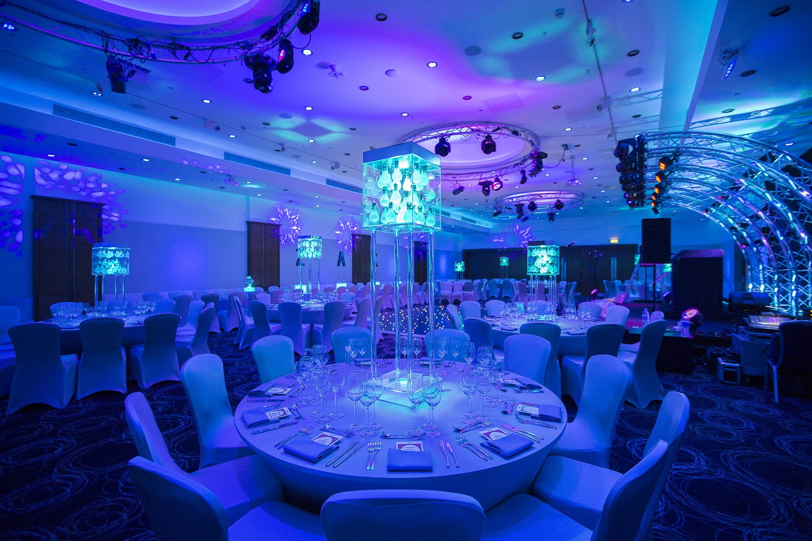 Elegant event space with round tables, ideal for upscale gala or corporate events.