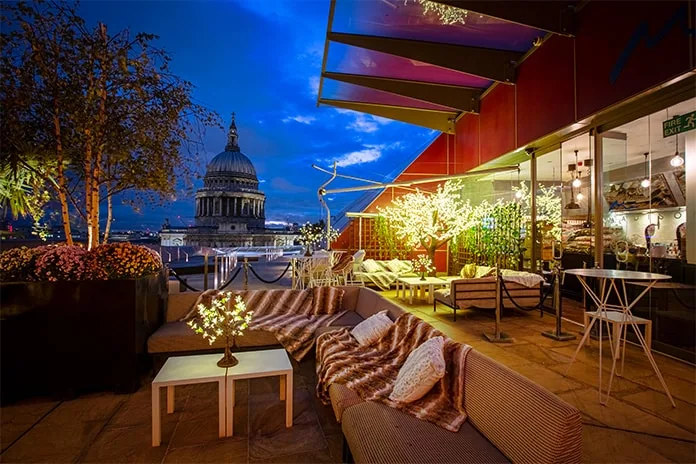Stylish rooftop venue at Azzurra Bar with St. Paul's Cathedral backdrop for events. - Banner