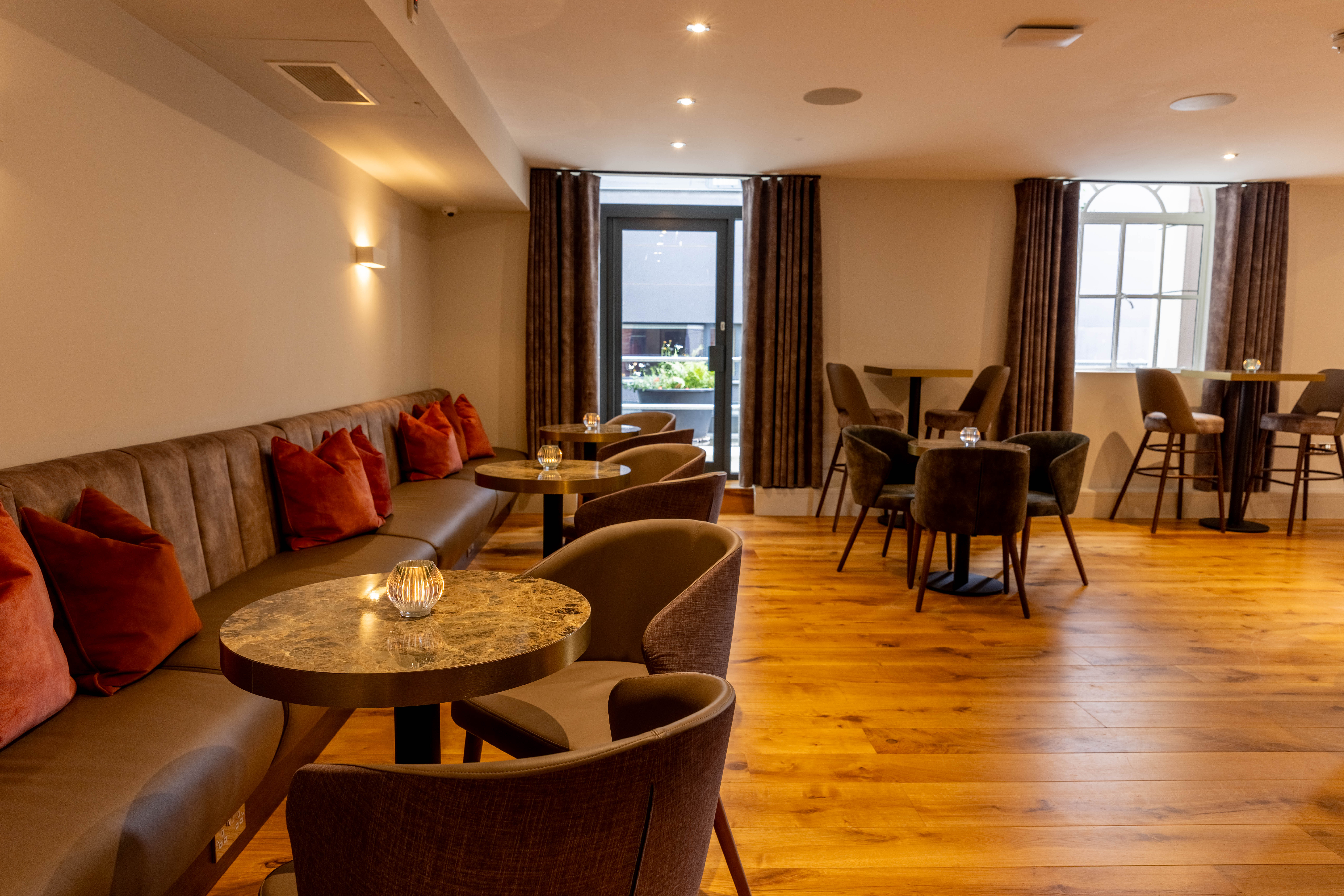 Stylish event space at Hope Street Hotel with plush seating for networking and gatherings.