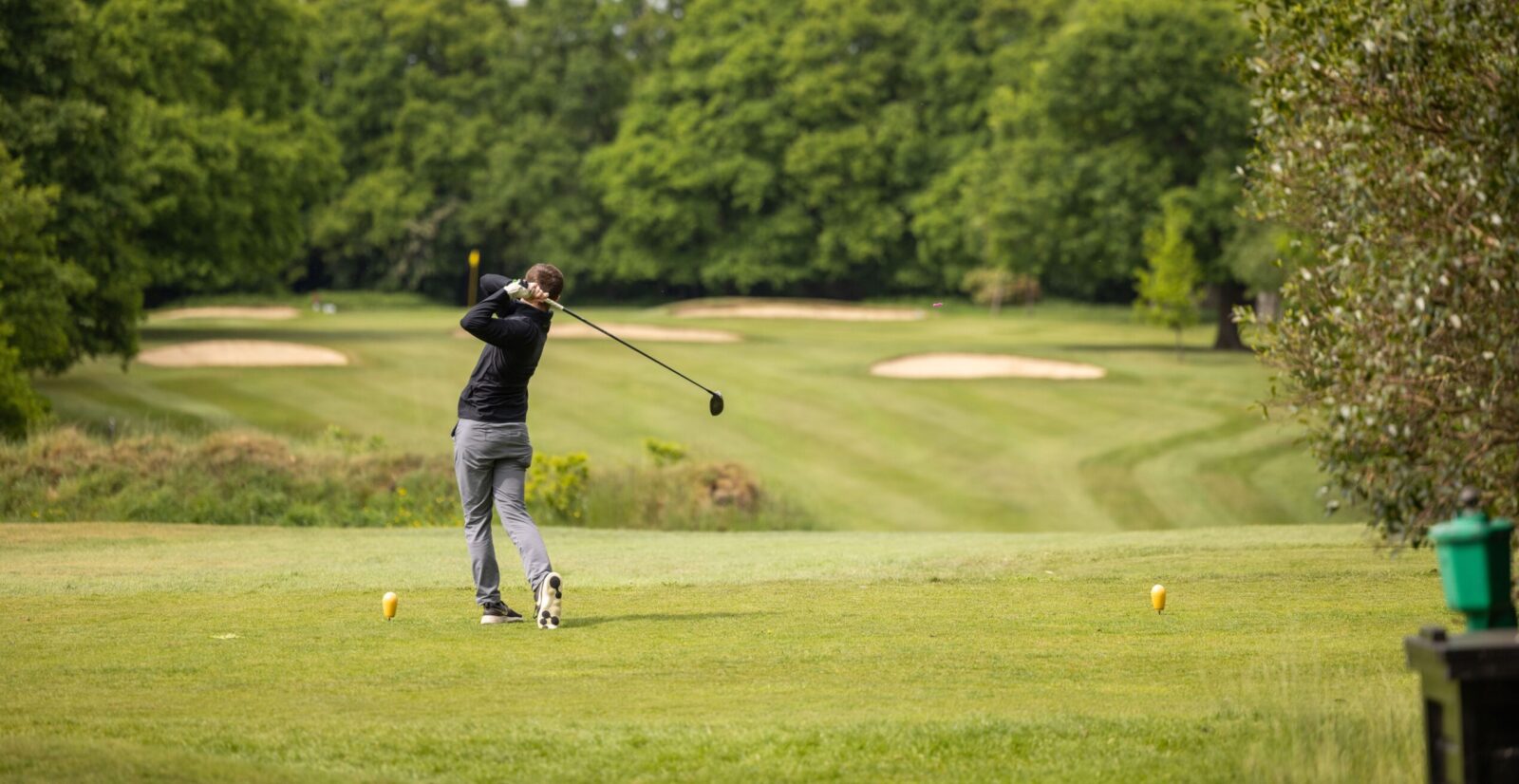 Golfer teeing off at The Ambassadors Club, Arkley Golf Club - ideal for corporate events. - Banner