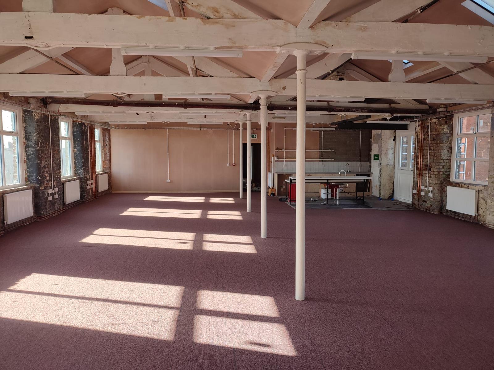 Spacious New Islington Mill venue with high ceilings for events and workshops. - Banner