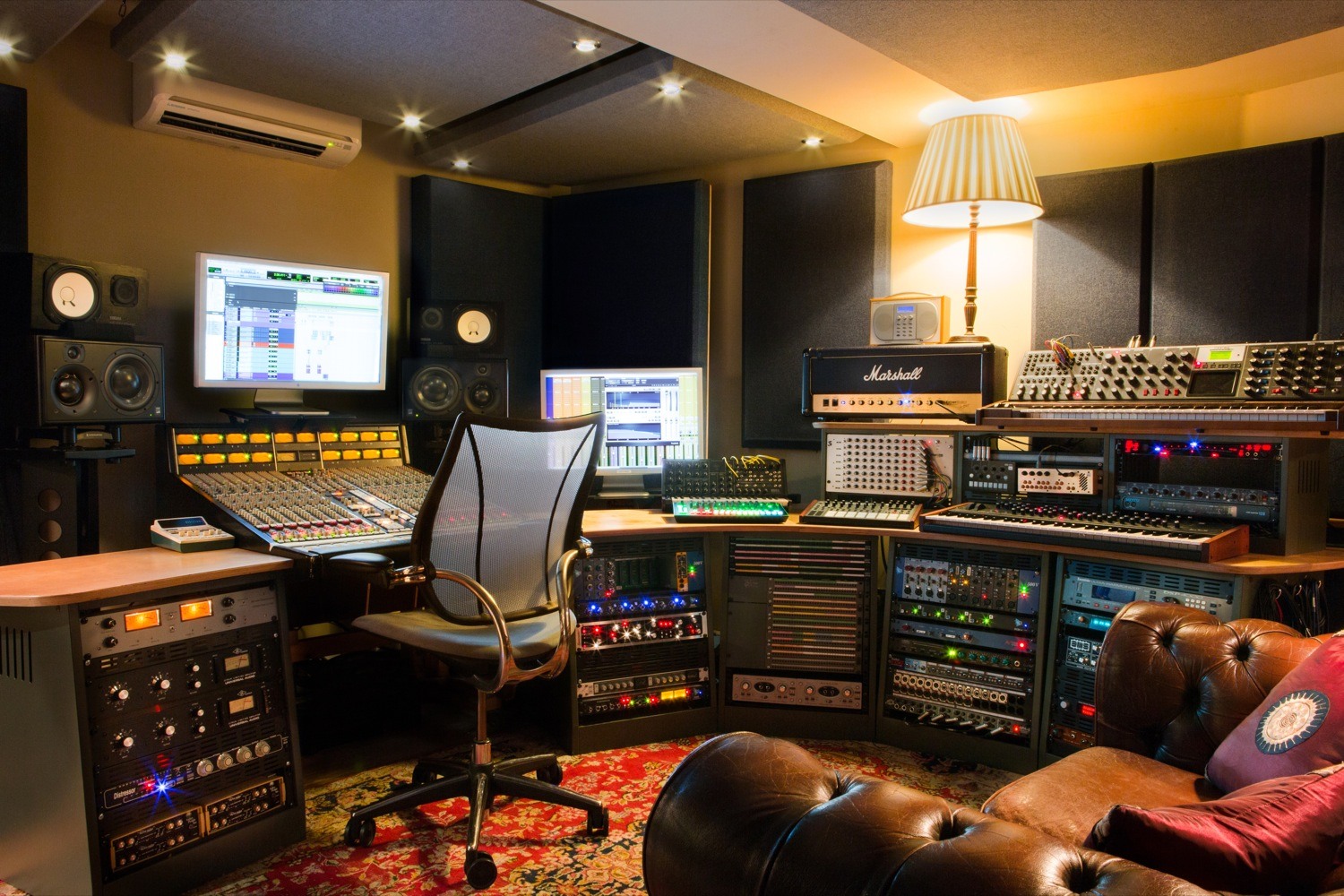 Recording studio with advanced audio equipment for creative workshops and events.