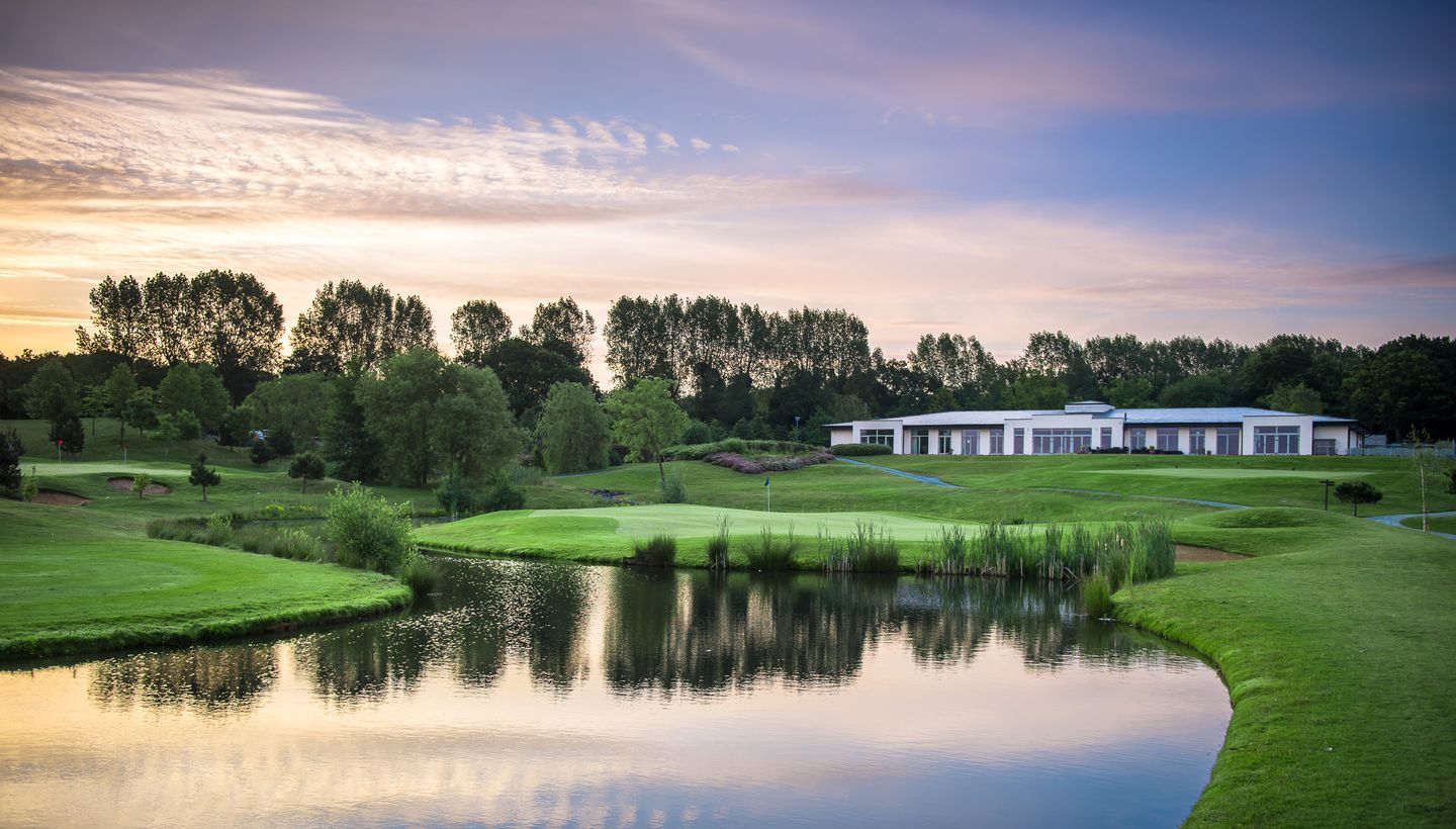 9 Hole Academy Course at The Shire London, serene golf setting for corporate retreats and events. - Banner
