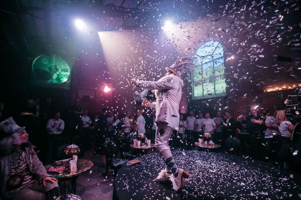 Vibrant performer in confetti at Village Underground for corporate events and celebrations. - Banner