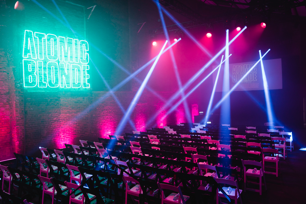 Vibrant event space at Village Underground with neon signage for dynamic presentations.