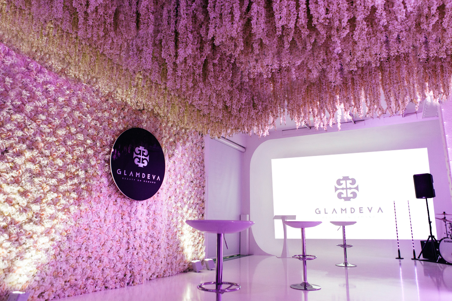 Elegant event space with floral ceiling for GLAMDEVA product launch and press events. - Banner