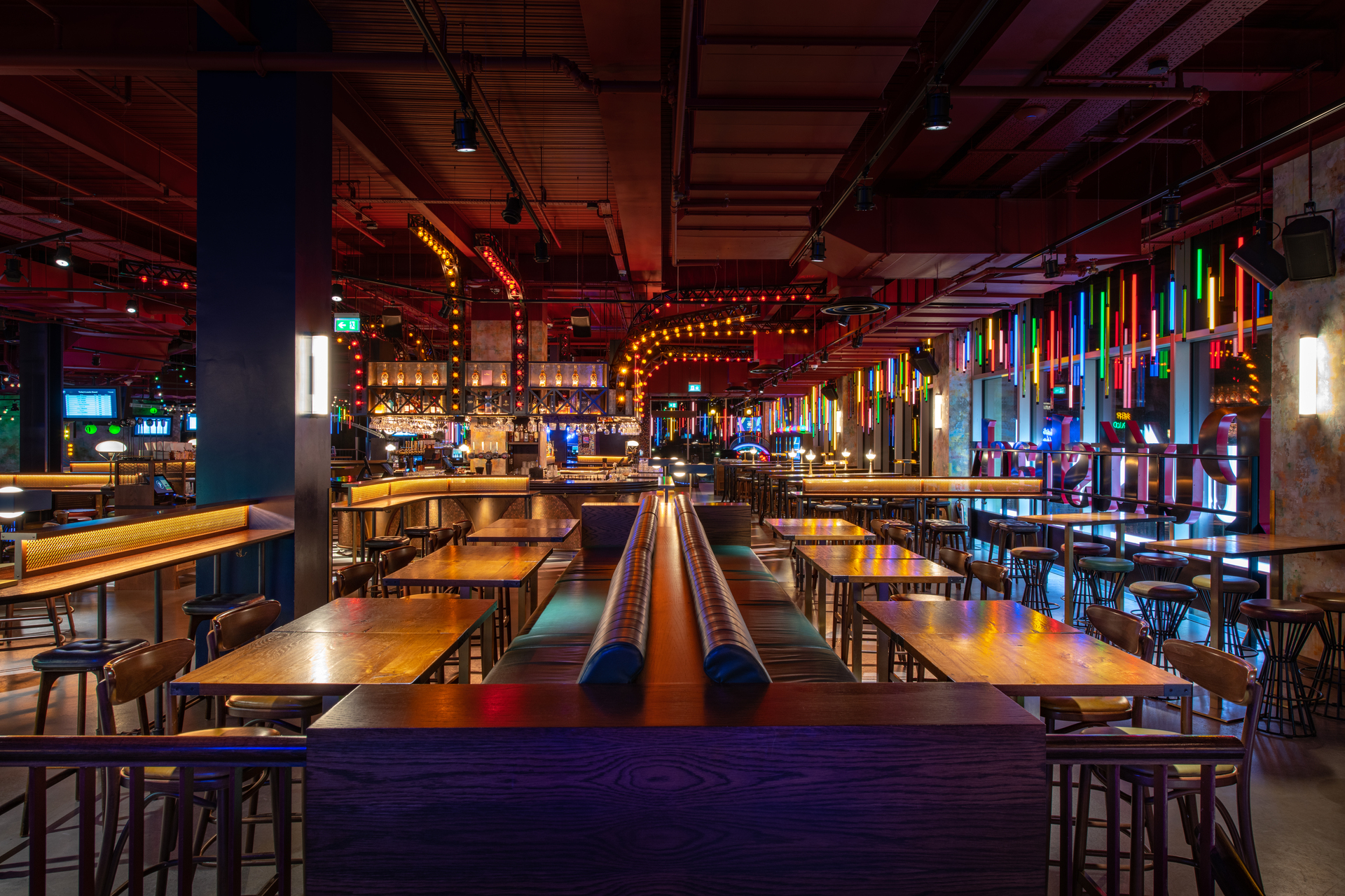 Christmas event space at Puttshack White City with modern design and vibrant lighting. - Banner