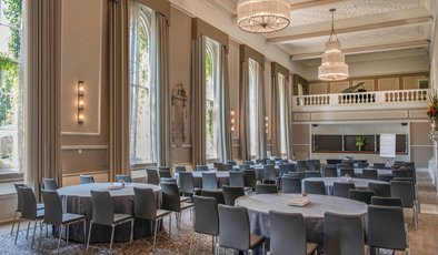 Hampton Suite at De Vere Beaumont Estate, spacious event room with chandeliers for conferences. - Banner