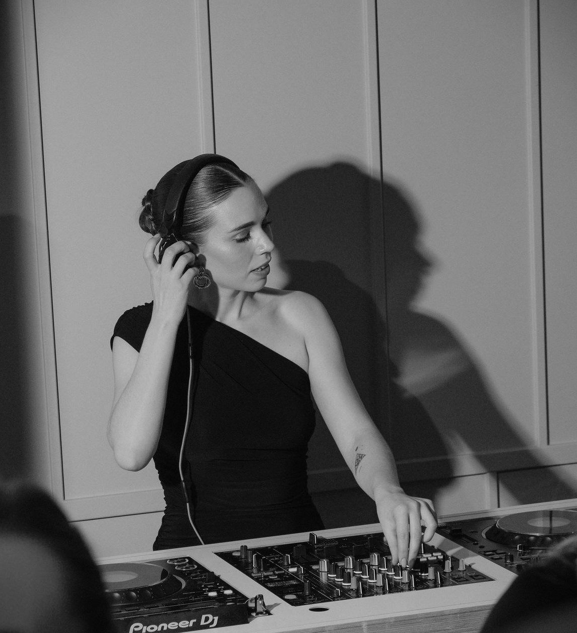 Professional DJ in sleek attire at upscale event in Creative Room 1, art'otel London.