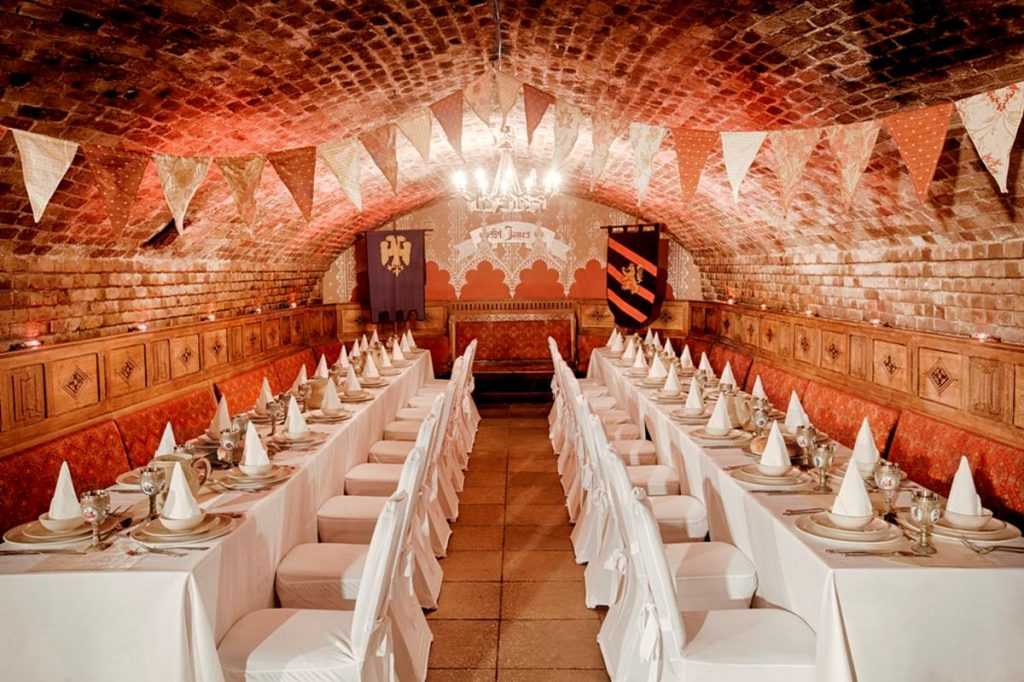 Elegant banquet hall with arched brick ceiling for upscale events and celebrations.