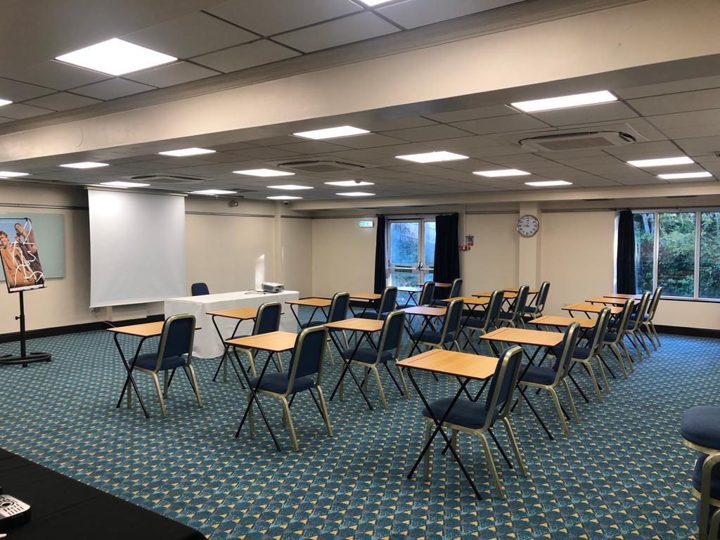 Prince of Wales meeting room setup for training session with projector and natural light.