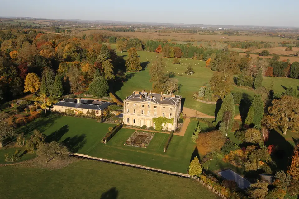 Filming at Courteenhall Estate with elegant architecture and vibrant autumn foliage. - Banner