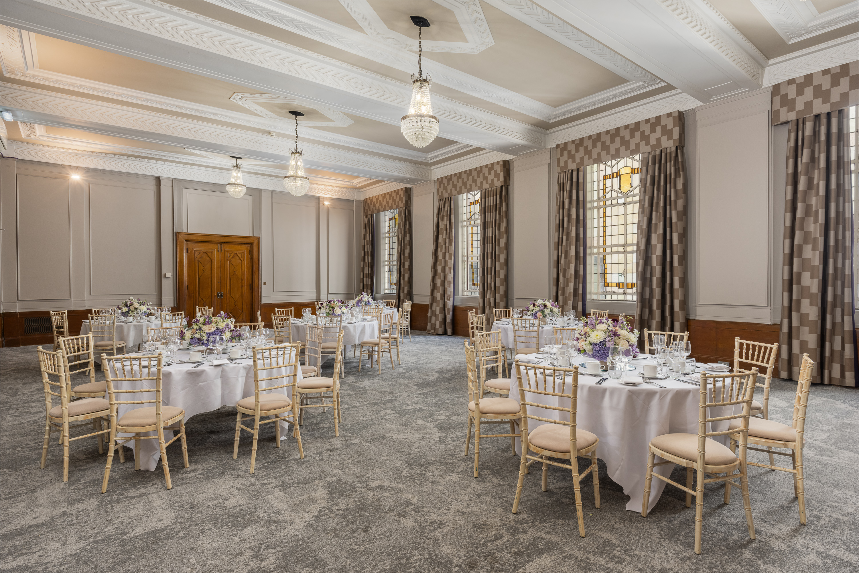 Cambria Suite ballroom with elegant chandeliers for gala dinner and wedding reception events.
