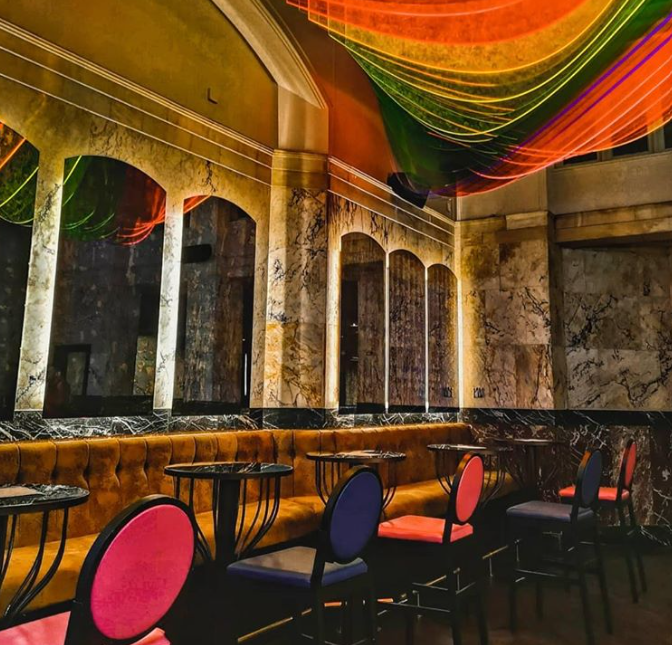 Elegant event space with marble walls, ideal for upscale receptions and gatherings. - Banner