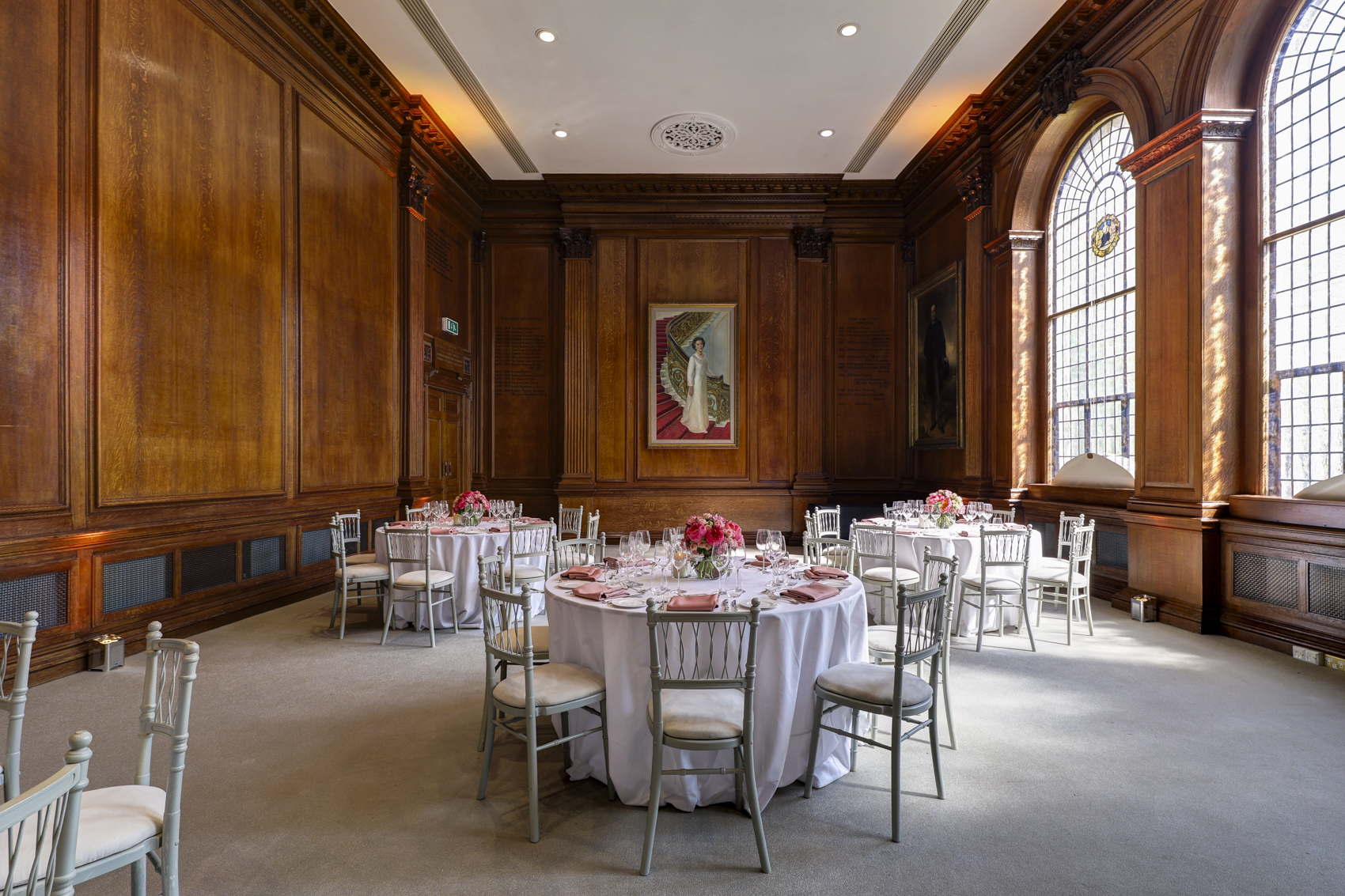 Elegant lecture hall with wooden paneling, ideal for weddings and corporate events.