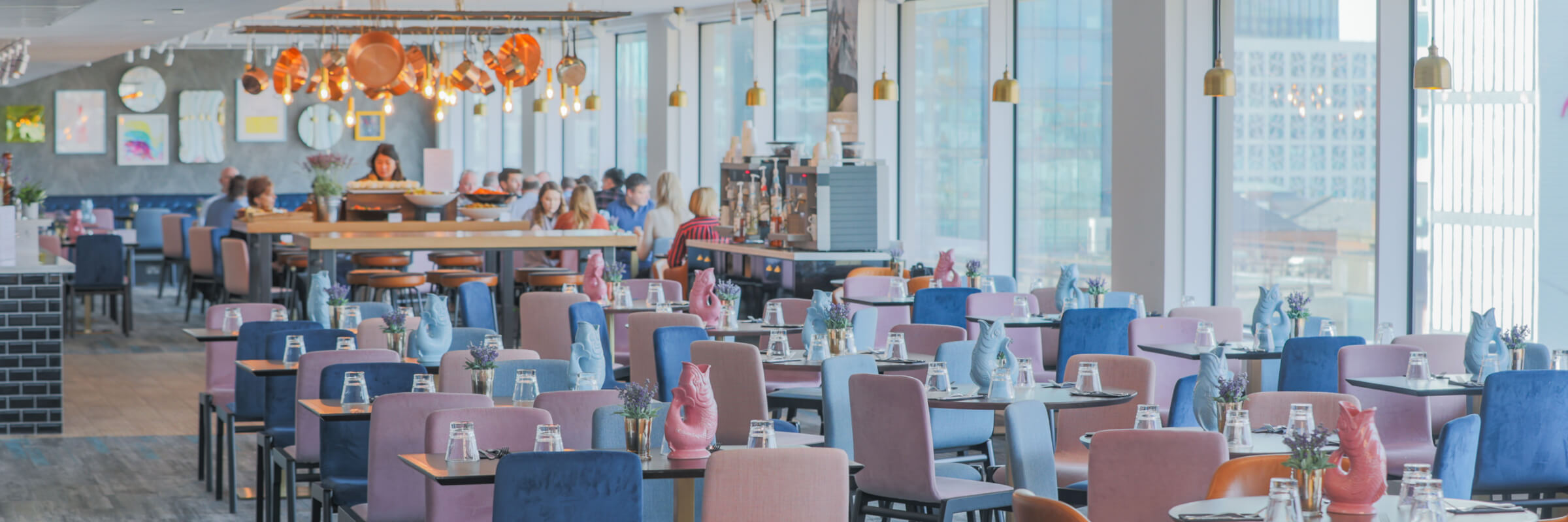 Modern meeting room in Etc.venues Manchester with vibrant chairs for events. - Banner