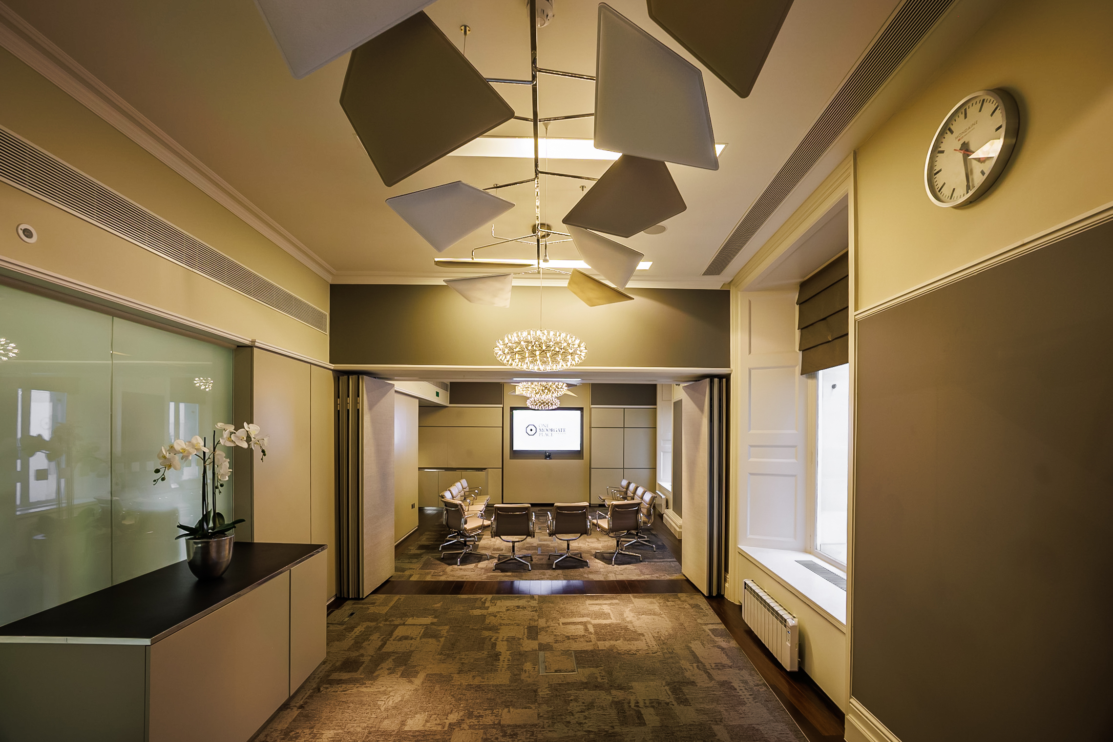 Modern London meeting room, natural light, executive event