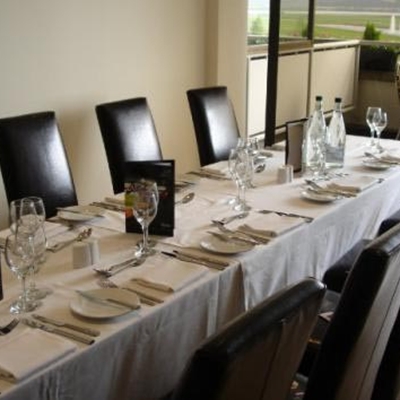 Elegant dining table setup for corporate meetings at Kempton Park Racecourse.