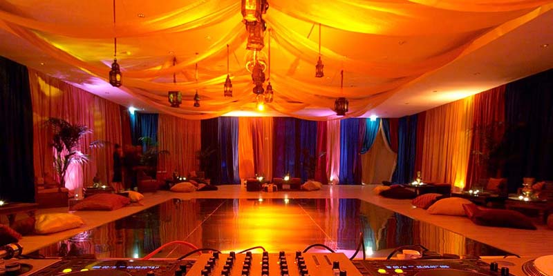 Private event at Hurlingham Yacht Club with elegant decor and warm lighting. - Banner