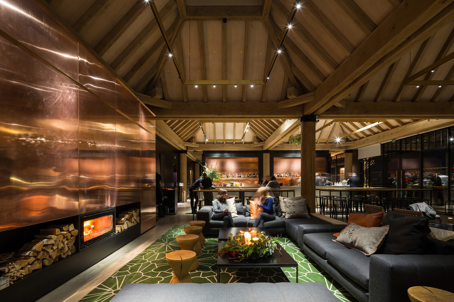 Stylish lounge area for networking events with cozy seating and warm lighting.