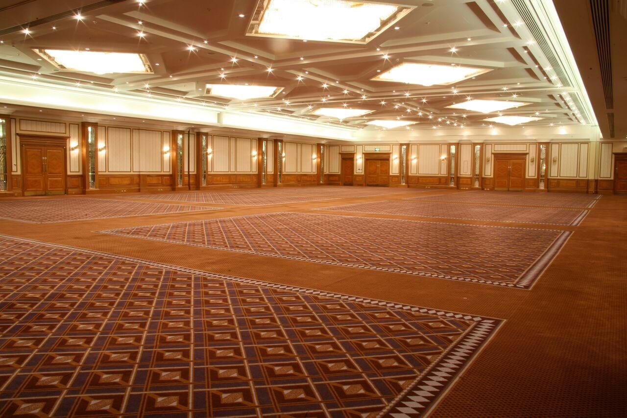 Elegant Britannia Suite with high ceilings, perfect for corporate events and weddings. - Banner