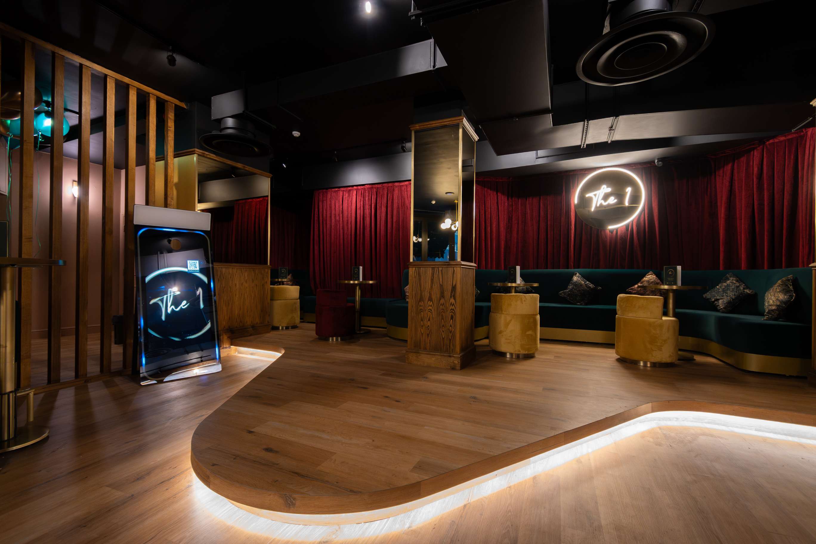 Stylish event space at The 1 Bar with plush seating, perfect for networking and gatherings. - Banner