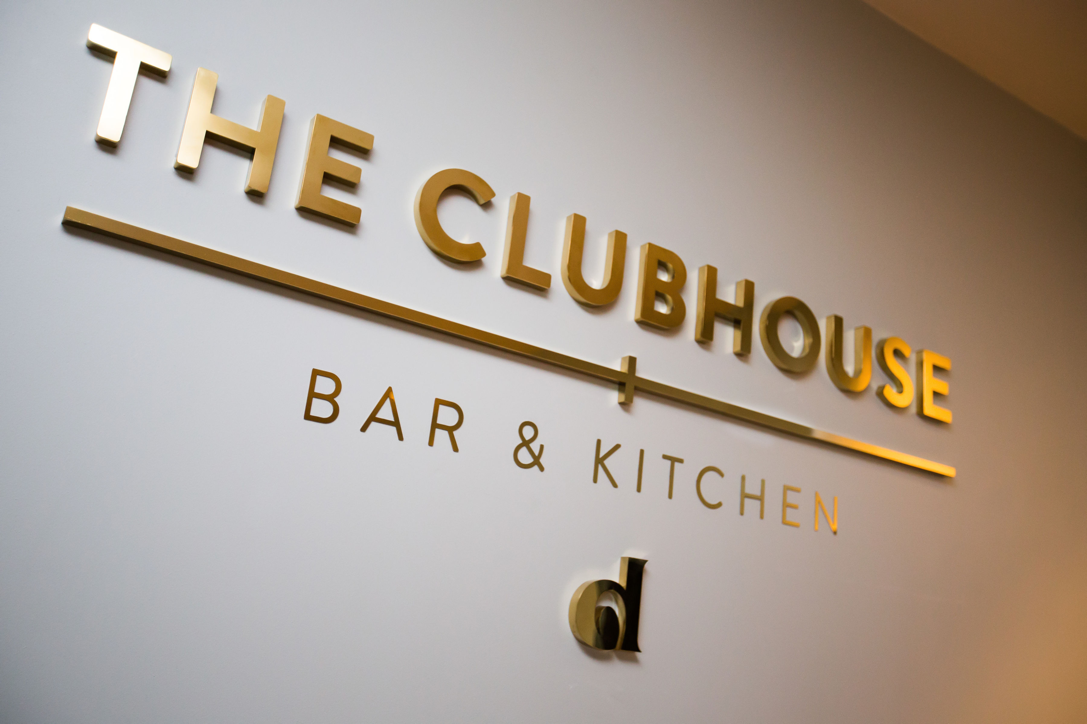 The Clubhouse Bar & Kitchen sign at Allianz Stadium, upscale venue for events and meetings.