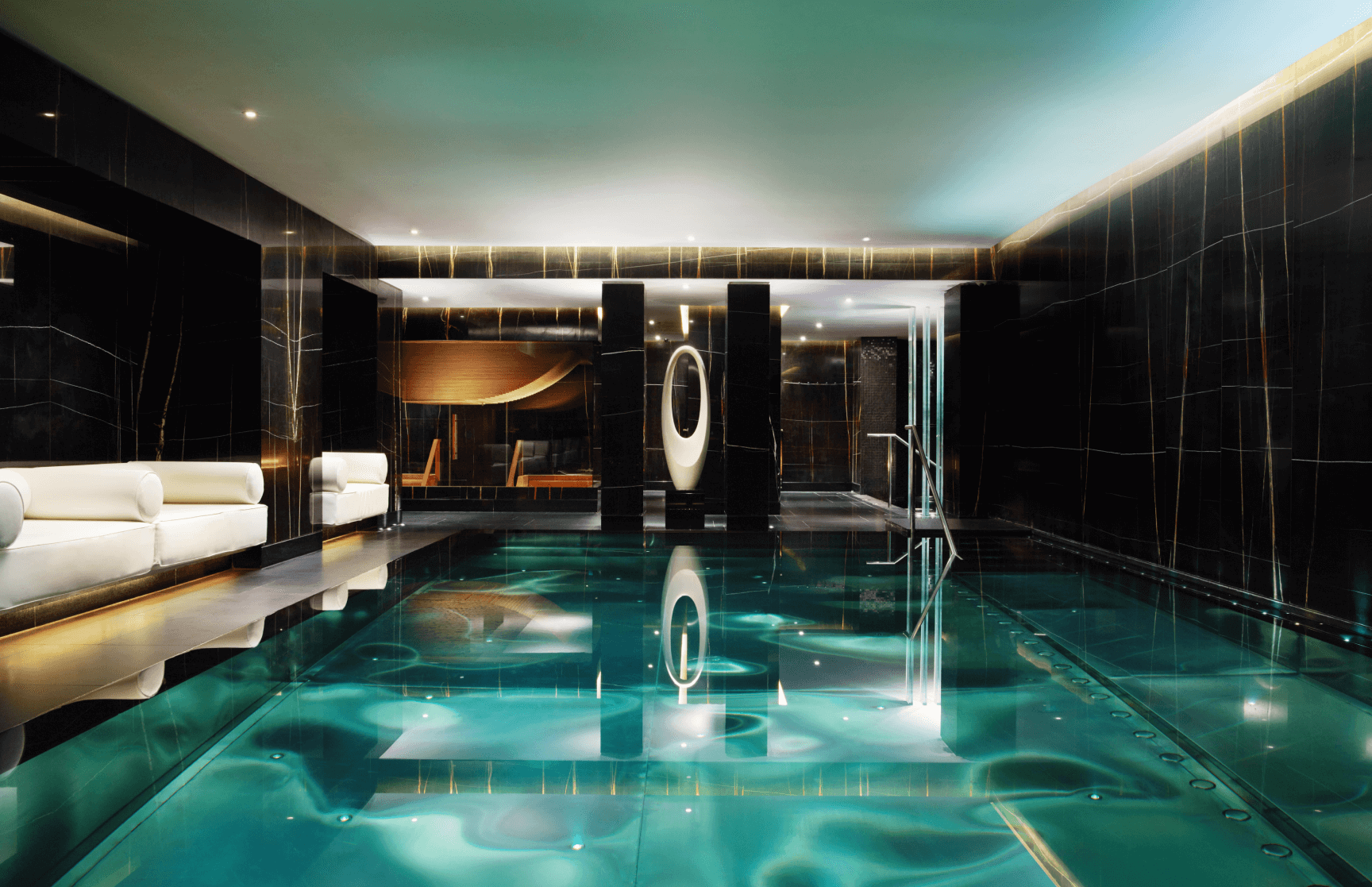 Luxurious indoor pool at Khamam Spa, perfect for exclusive events and retreats. - Banner