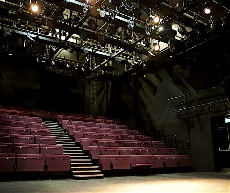 Main Stage at So Called Studios with tiered seating for intimate performances and workshops.
