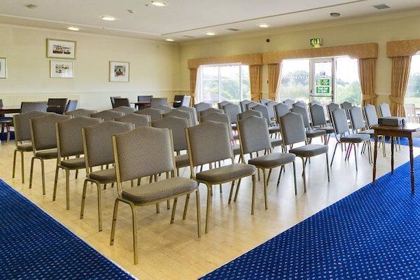 Function Room in HGC Club with arranged chairs for presentations and workshops.