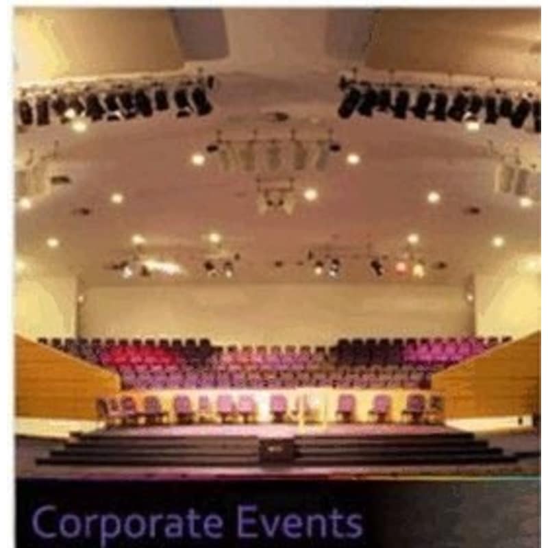 Main auditorium at Bethel Convention Centre with tiered seating for conferences and performances. - Banner