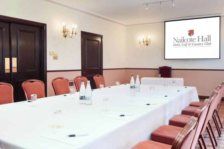 Wellingtonia Suite at Nailcote Hall: corporate meeting room with natural light and large screen. - Banner