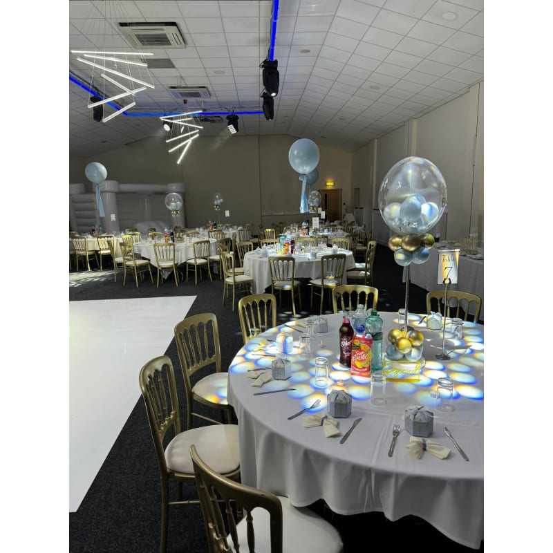 Elegant event hall with gold chairs, perfect for celebrations and corporate gatherings.