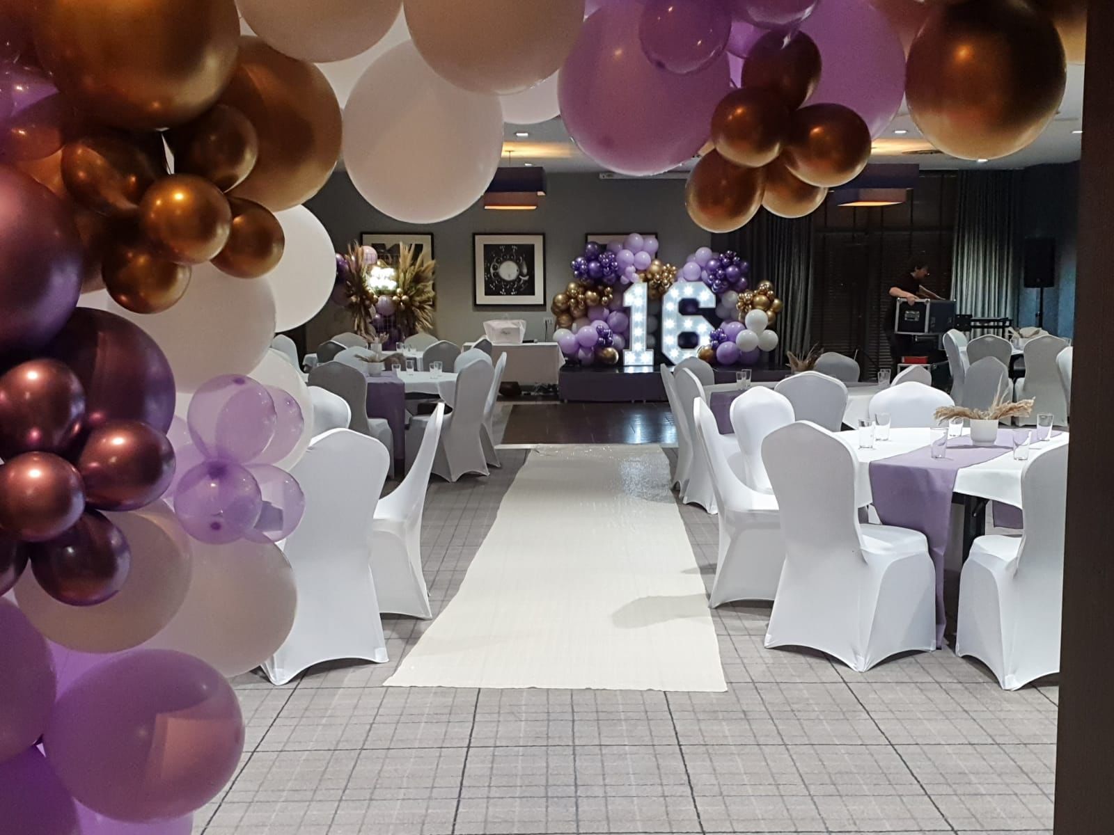 Function room at Village Hotel Solihull with elegant purple and gold decor for sweet sixteen events. - Banner