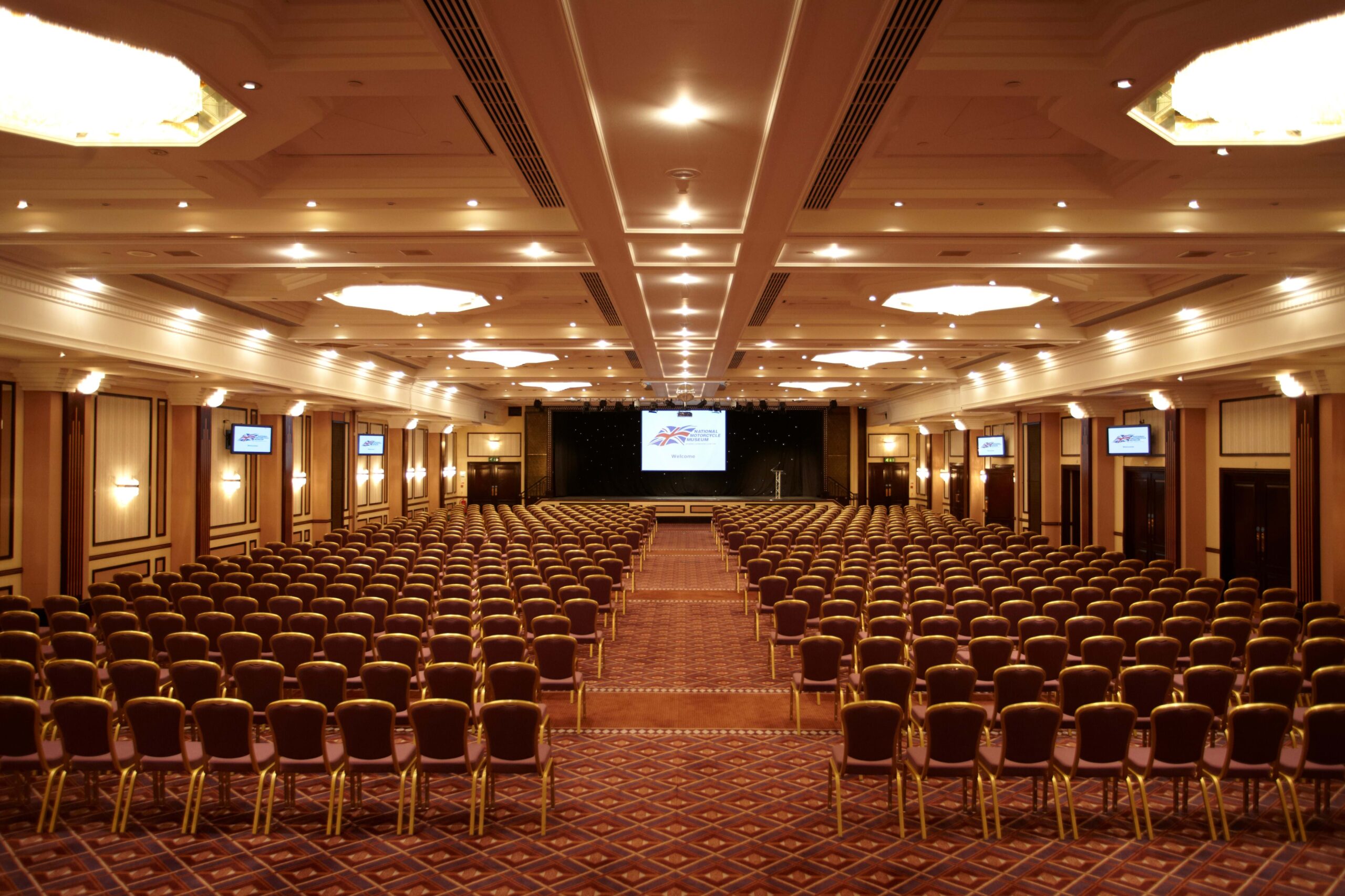 Spacious conference hall in Prestige Suite, ideal for large events and presentations.