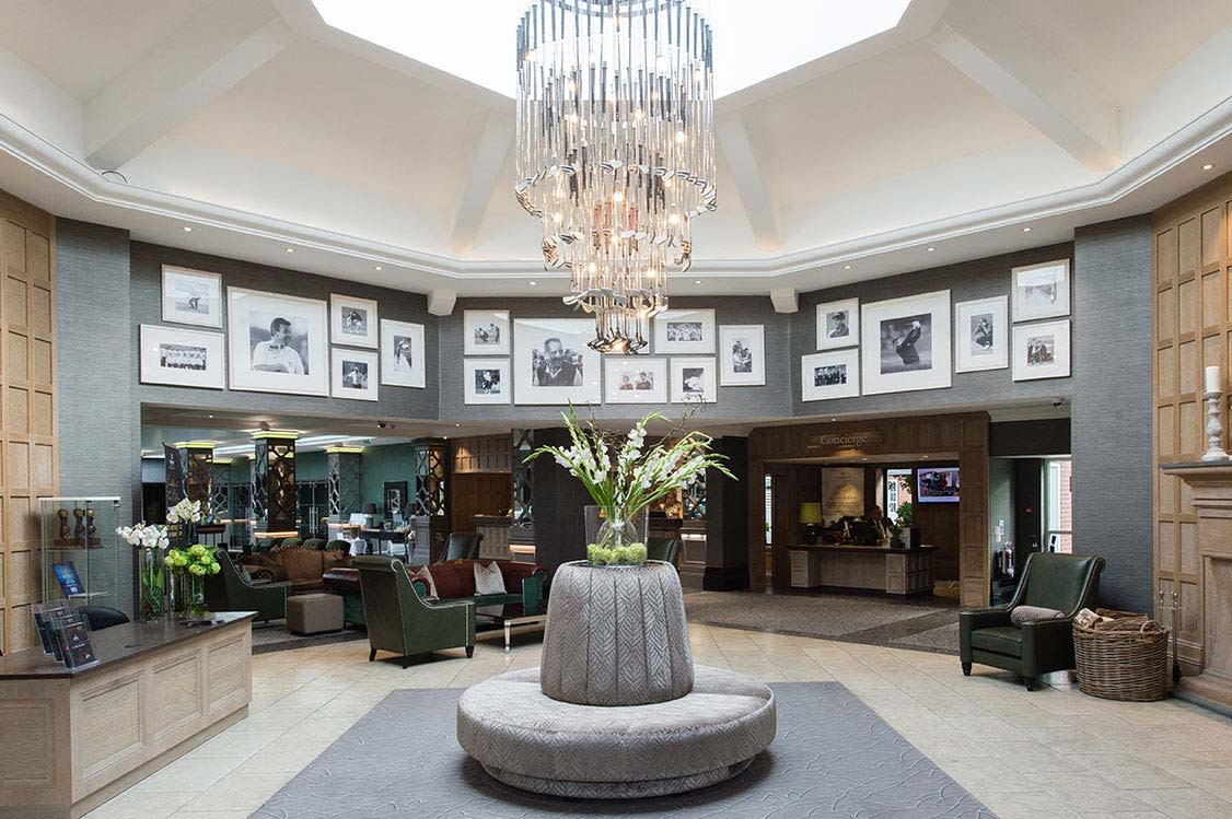 Elegant hotel lobby with chandelier, ideal for meetings and events at The Belfry.