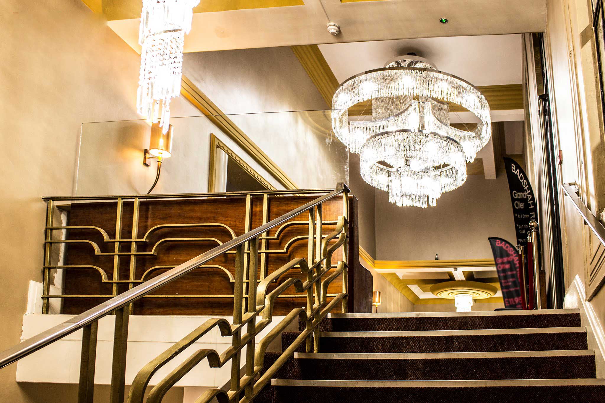 Elegant staircase in Badshah Palace restaurant, ideal for upscale events and gatherings.