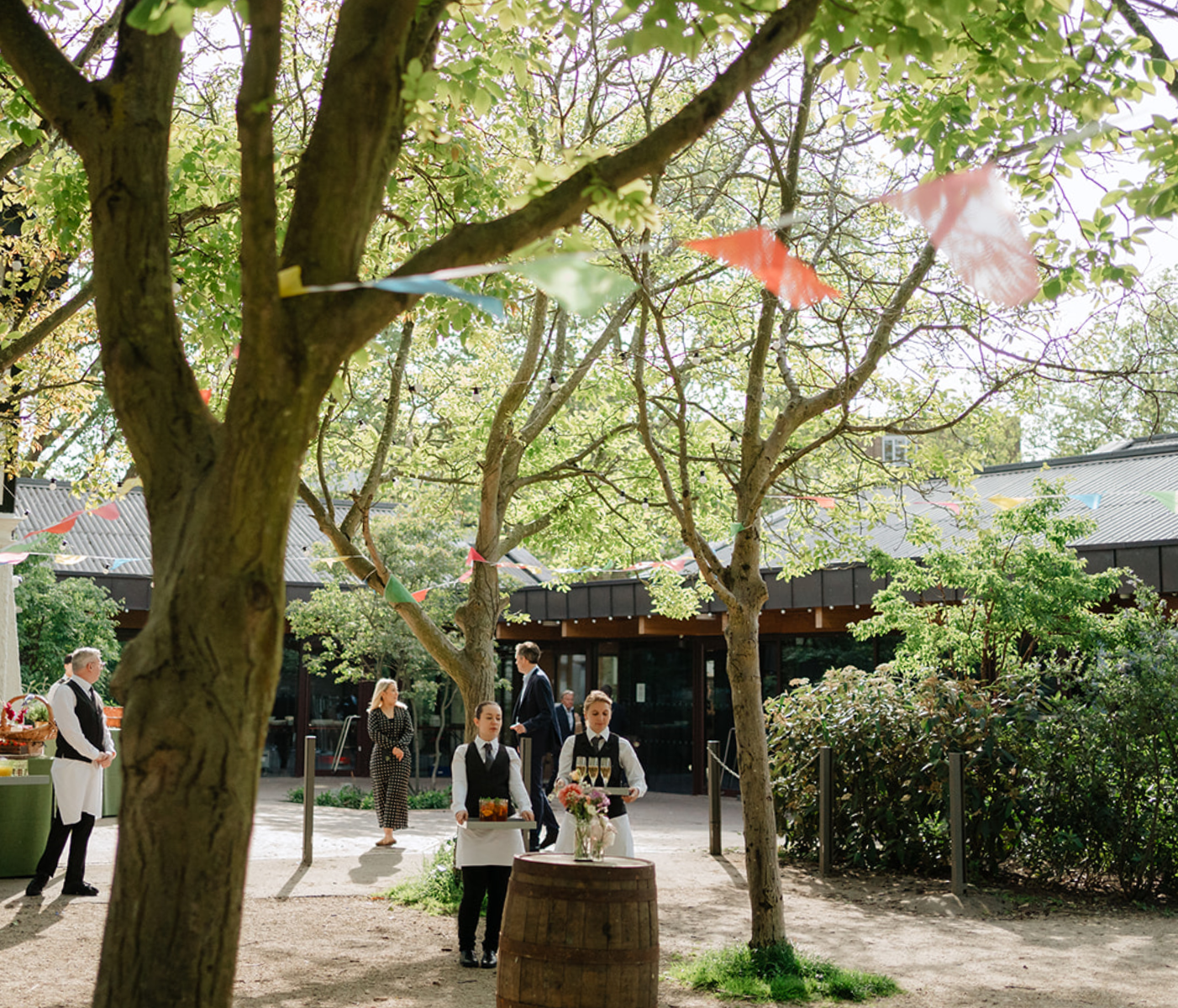 Outdoor event space in Sands End with lush greenery, perfect for networking gatherings. - Banner